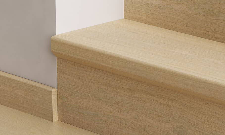 close up of stairs with beige wooden stair covers